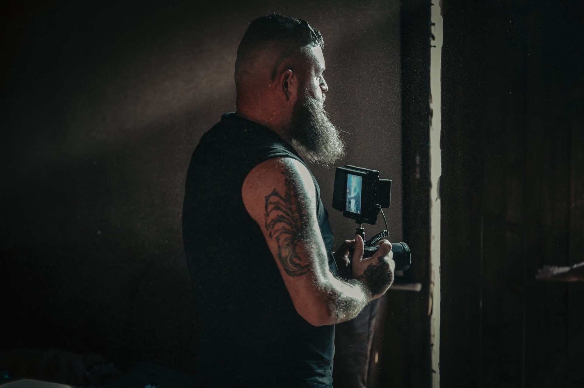 Justin Paul on set with camera and smoke effects